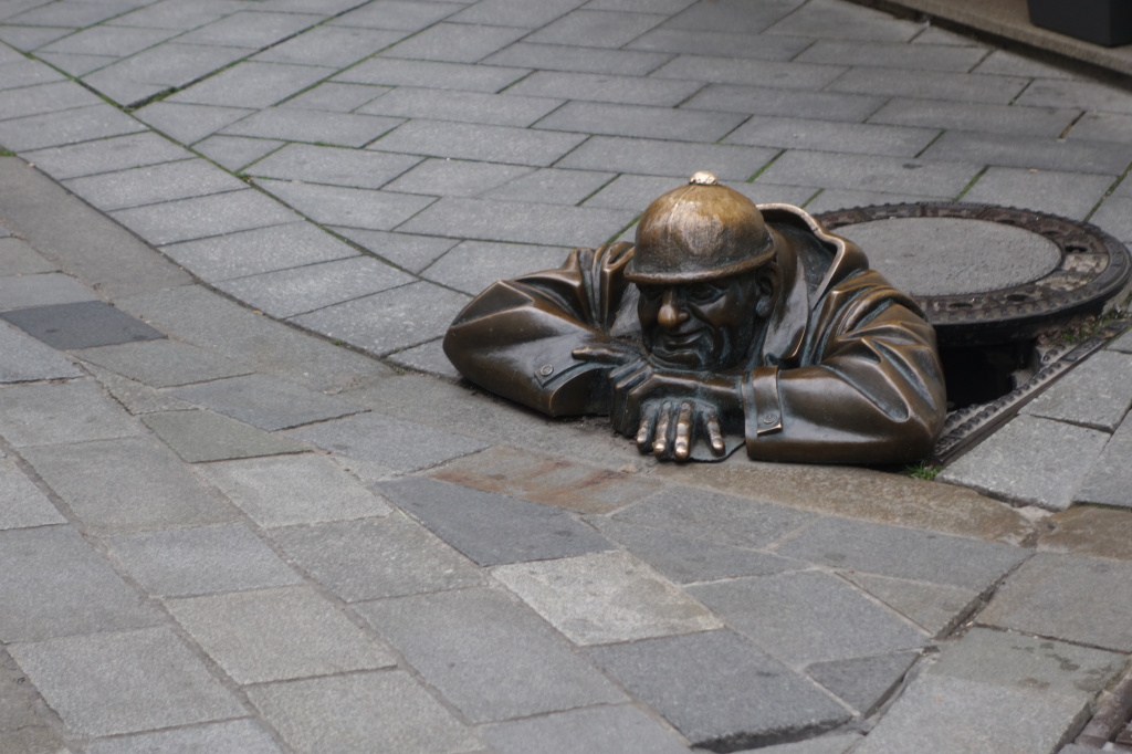 Manhole worker sleeping on the job - Bratislava, Slovakia