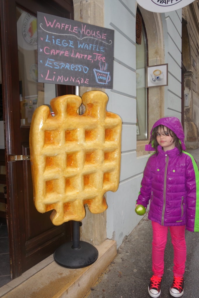 girl with waffle, giant waffle, waffle statue