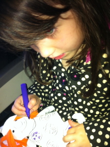 little girl coloring on a plane